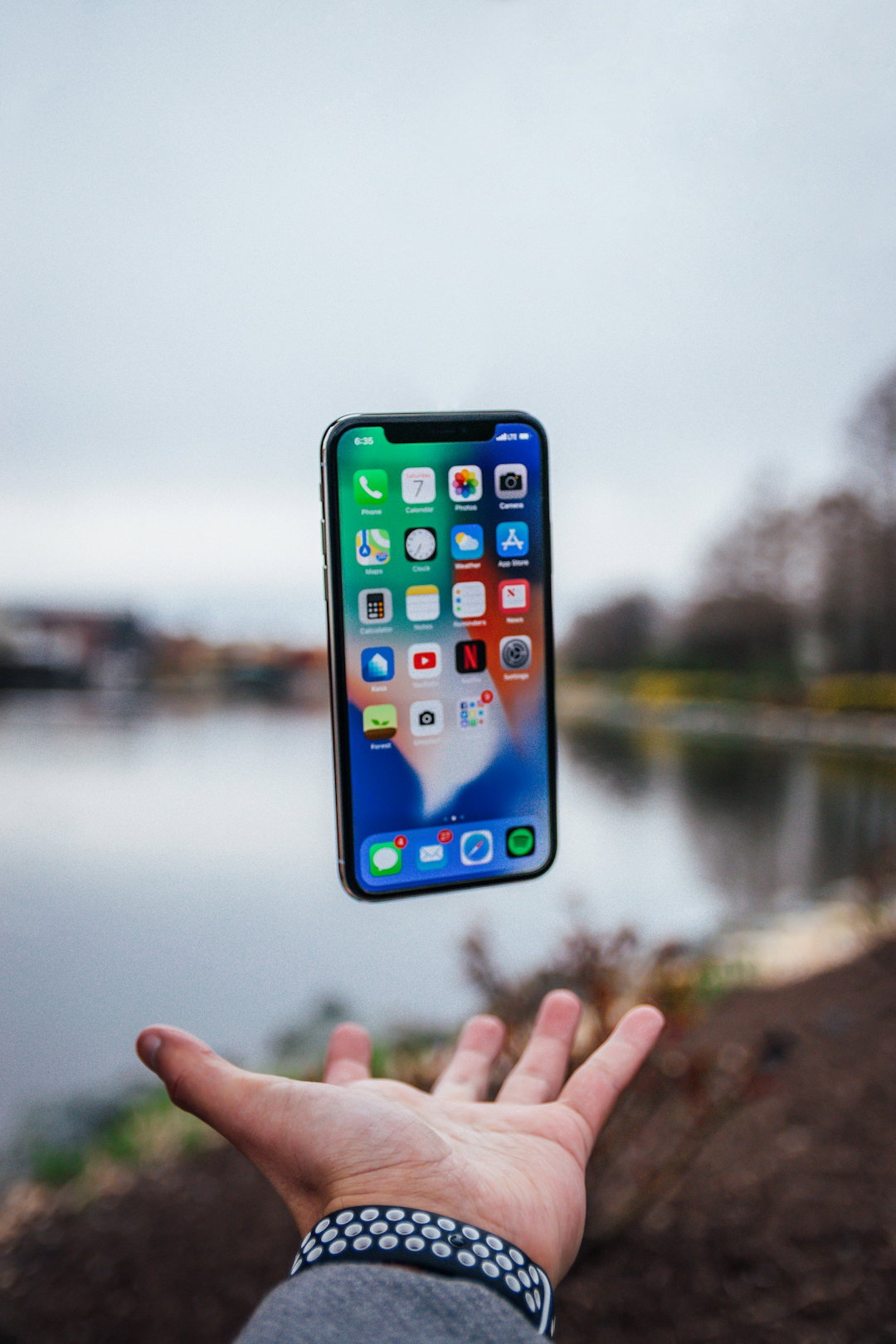 silver-i-phone-x-floating-over-open-palm.jpg silver iPhone X floating over open palm